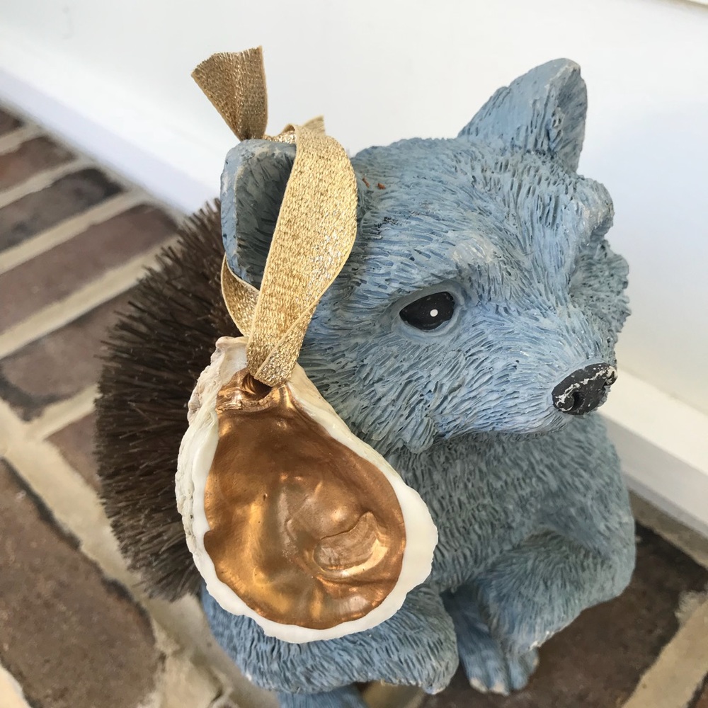 Oyster ornament with gold accent detail